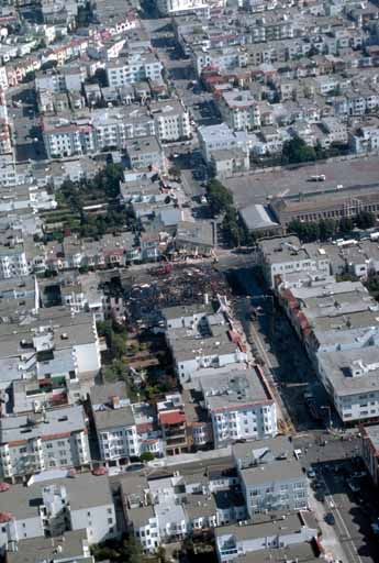 Aerial view of collapsed buildings and burned-out section at Beach and Divisadero Streets, Marina District; C.E. Meyer, U.S. Geological Survey