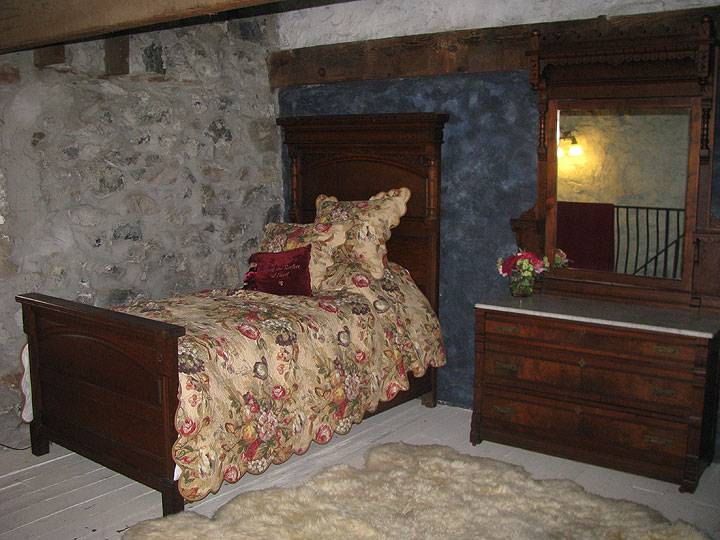 Albion-old-bed-in-stone-bedroom 5890.jpg