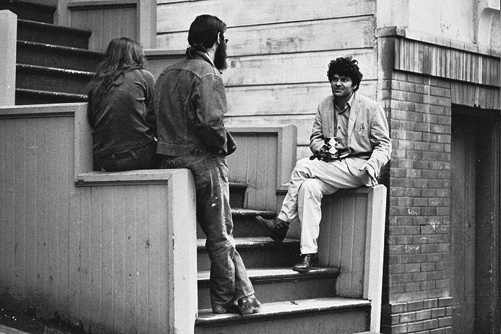 Gregory-korso-on-stairs-talking-to-friends 0387 Chuck-Gould.jpg