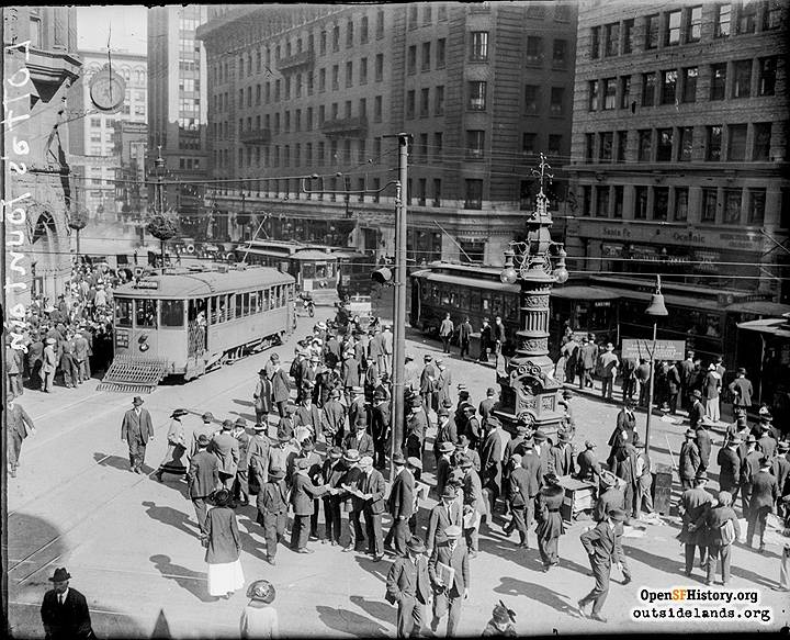 1915-streetcars-at-Kearny-Geary-and-Market D-car-Lottas-Fountain-Palace-Hotel-in-background-D-car-destination-reads-Exposition 2 wnp30.0082.jpg