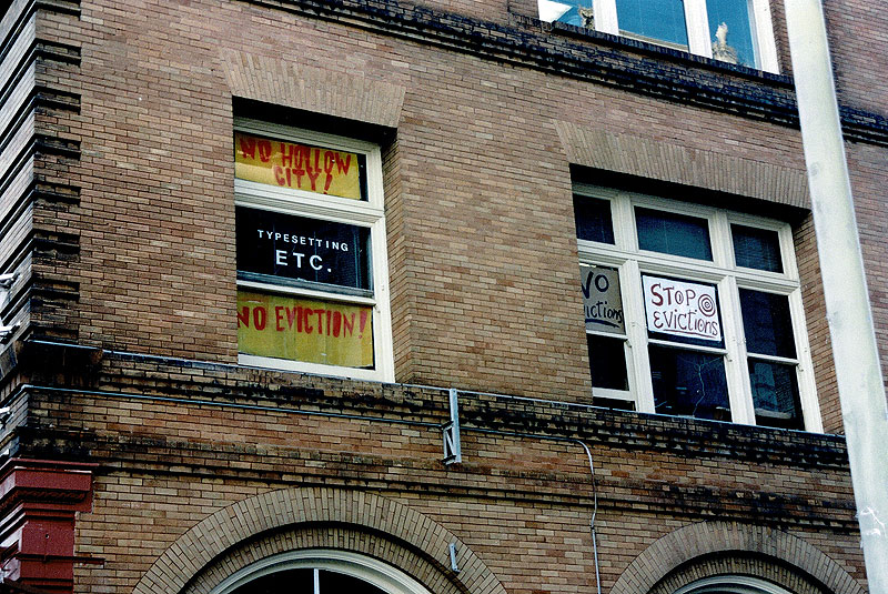 Signs-in-window-at-TE-against-evictions-2000.jpg