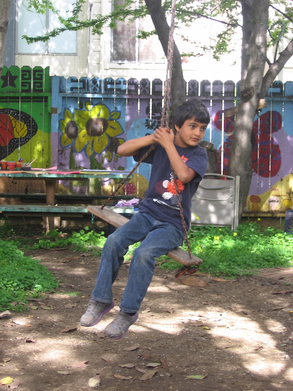 Young boy on swing in Jardín Secreto IMG 9299.JPG