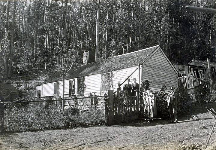 The-Old-home-in-the-Heart-of-the-Sutro-Forest,-back-of-Twin-Peaks,-built-about-1860.-Photo-taken-Jany-1925.-Jesse-B.-Cook-at-the-gate.jpg
