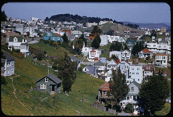 File:Cushman-March-15,-1955-view-north-from-diamond-hts-towards-Corona,-green-slopes-and-shacks-P07707.jpg