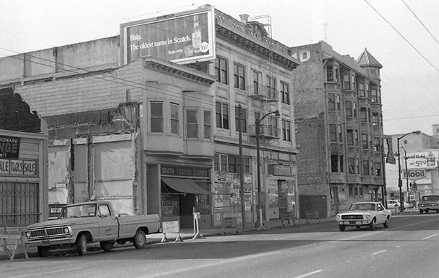 Buildings on the 700 block of Howard before being demolished as part of South of Market Redevelopment, South Center Library and Jim's General Merchandise as seen from across the street Oct 1970 TOR-0007.jpg