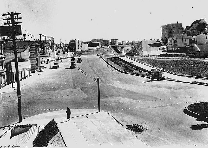 File:San-Jose-Ave-sw-at-Dolores-and-Randall-w-Mission-back-left--Highland-overpass-in-center-distance-This-was-Opening-Day-for-new-Bernal-cut-April-16-1930-SFDPW.jpg