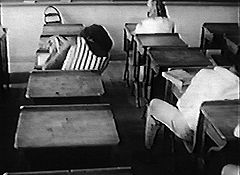 Kids asleep in largely deserted Mission High classroom, 1969
