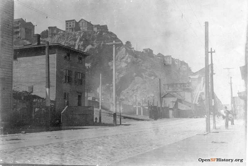 C1900 View north on Sansome toward Vallejo. Grey Brothers Quarry and Rock Crusher on east side of Telegraph Hill. Houses on the cliff on the 200 block of Green near Montgomery wnp27.4952.jpg