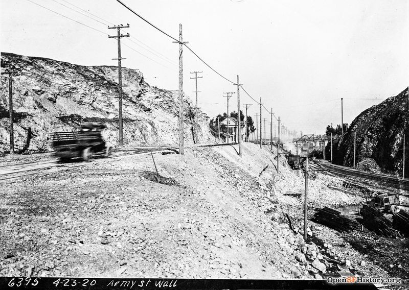 Army Street Wall, View east on Army Street (now Cesar Chavez) near present day Evans. Ocean Shore Railway tracks at right, footbridge at Connecticut Street in distance--wnp36.02268.jpg