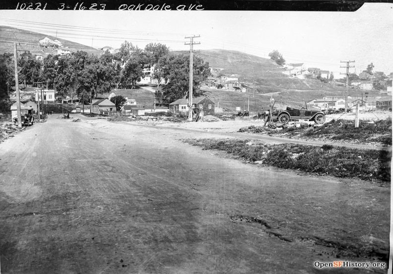 March 16 1926 View West on Oakdale near Toland. Old Clam House at the intersection of Bayshore (then San Bruno Avenue). Bernal Heights and site of US101 freeway in background. Oakdale Ave to Bernal dpwbook36 dpw10221 wnp36.03371.jpg
