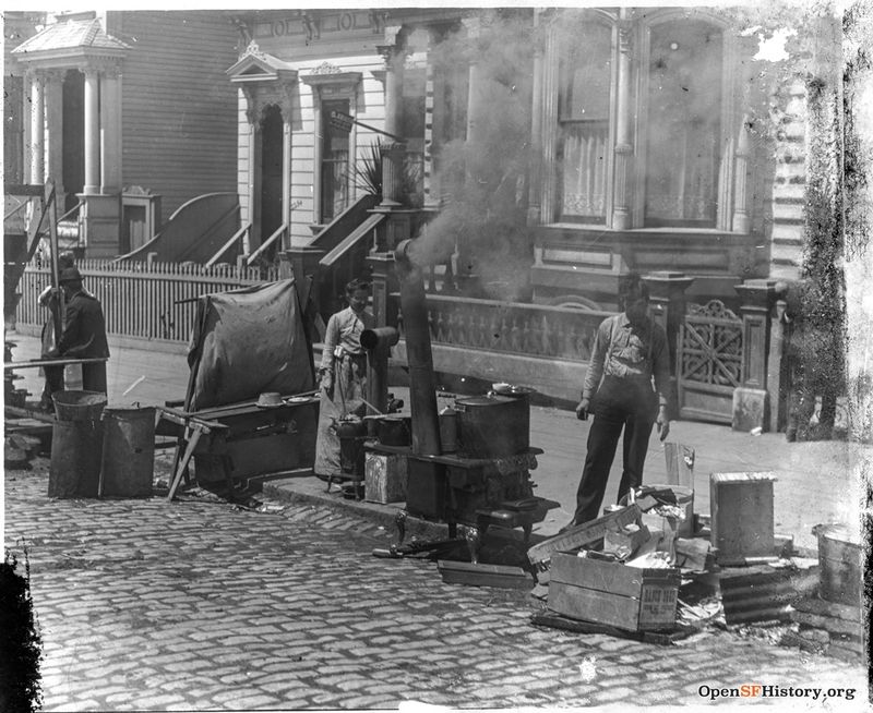 1906 Earthquake and Fire, North side of Bush Street between Fillmore and Steiner, 2250 Bush and 2254 Bush in the background. Families cooking in the streets on wood-burning stoves wnp13.426.jpg