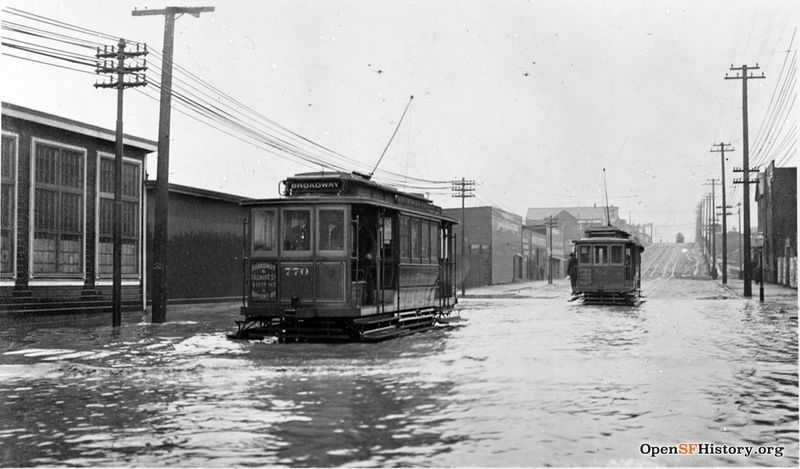 1905 16th St, at Folsom, looking east. Streetcars driving through flood, car 770 wnp32.0263.jpg